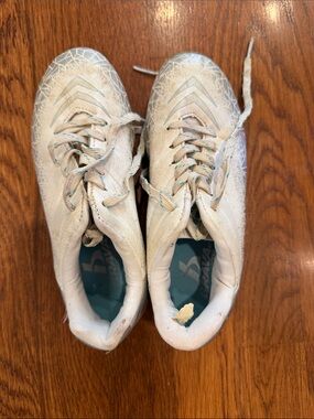 White Athletic Cleats with Teal Accents
